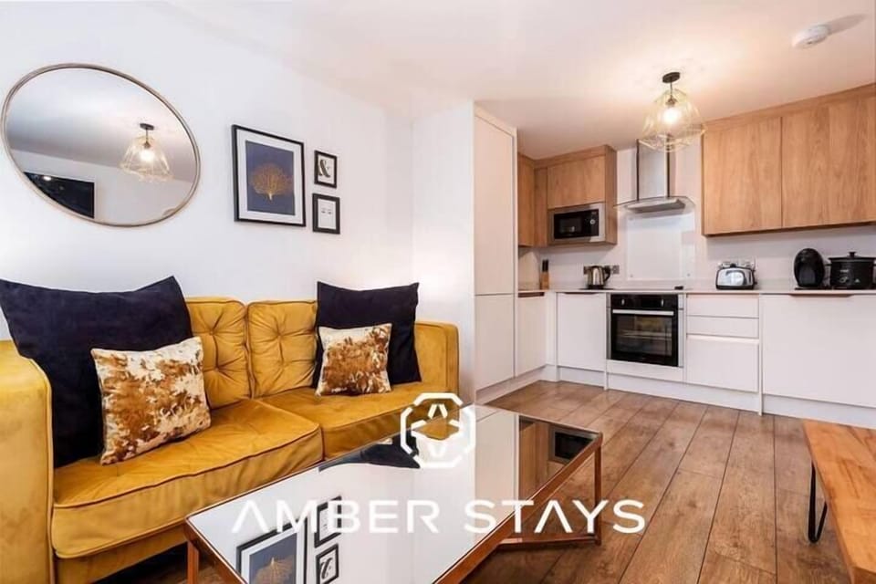 A stylish and comfortable living room, filled with natural light and cozy seating for relaxing or socializing