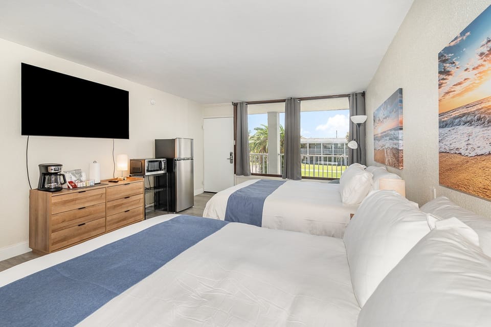 A clean, modern layout featuring a flat-screen TV and all the essentials you need for a seamless short stay.