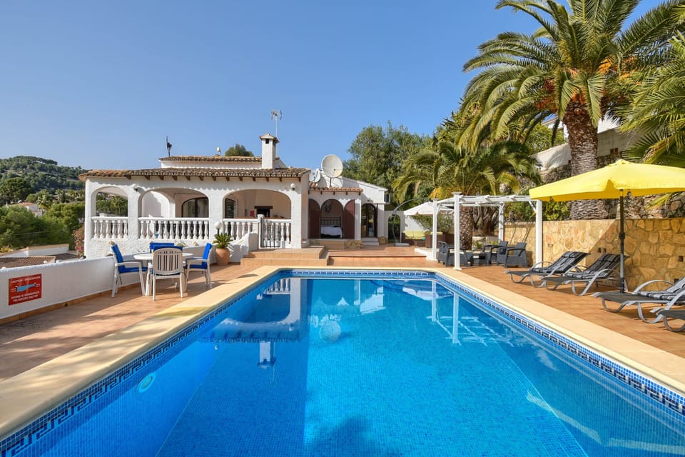 Private swimming pool with Roman stairs and comfortable loungers
