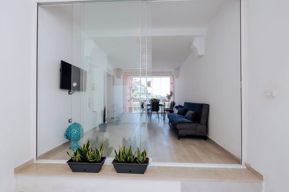Deluxe Apartment | Living area | 42-inch flat-screen TV with digital channels