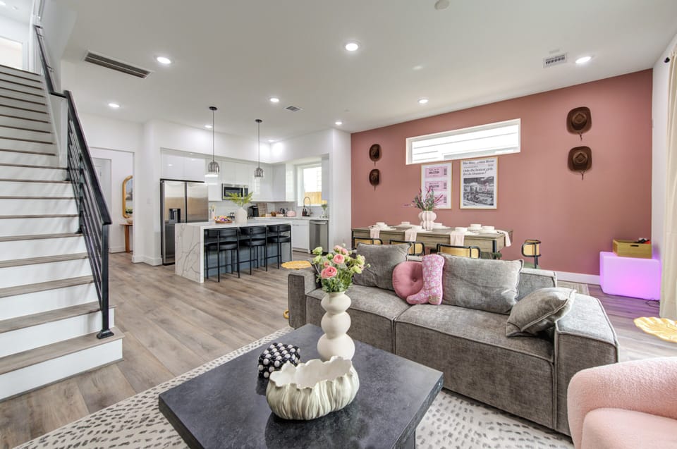 Open floor plan concept featuring living room, dining area, and kitchen