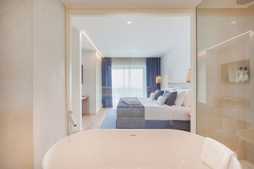Suite, Sea View | Minibar, in-room safe, blackout drapes, iron/ironing board
