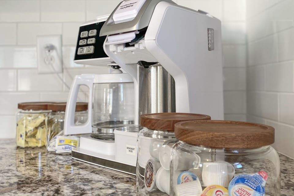 We provide a coffee bar with creamer, Splenda, sugar, grounds, and K-cups.