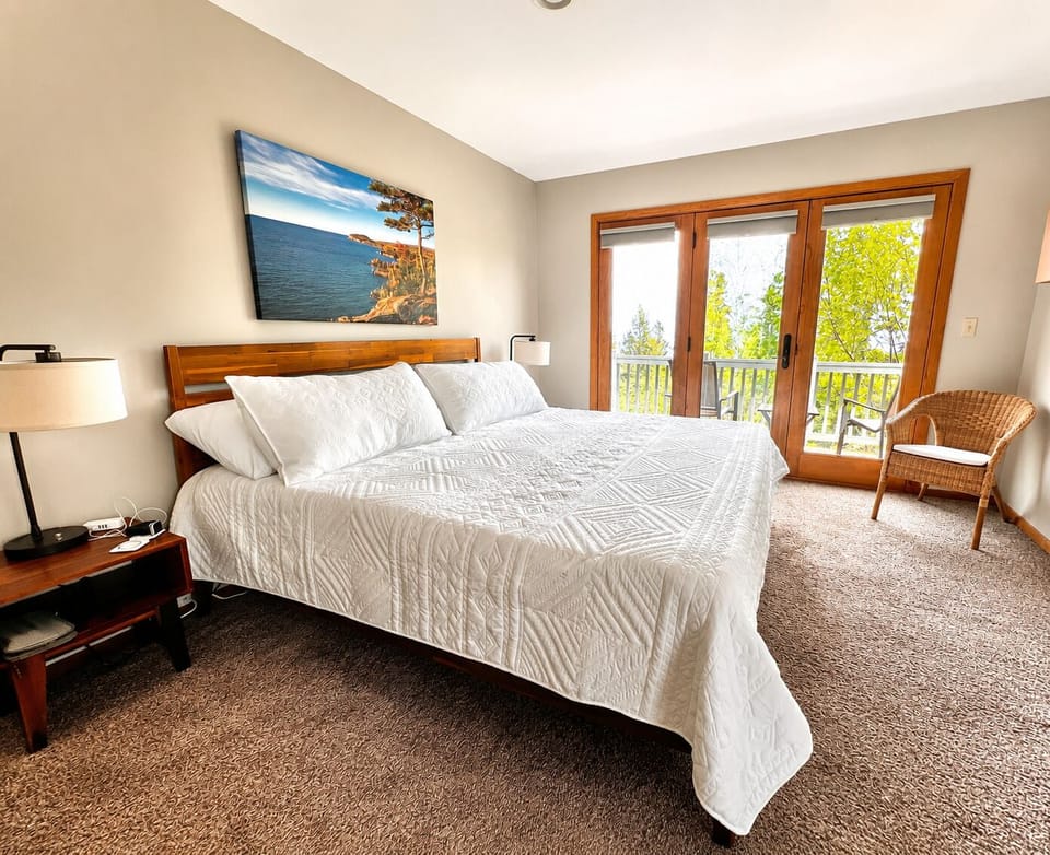 Sink into the king bed and step out onto the deck.