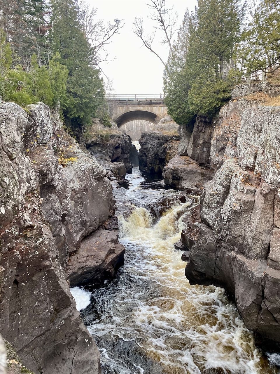 Stunning gorge at Temperance River State Park, featuring rushing waters and a bridge spanning the canyon. Just 5.6 miles from our cabin, it’s the perfect spot for a quick hike. 