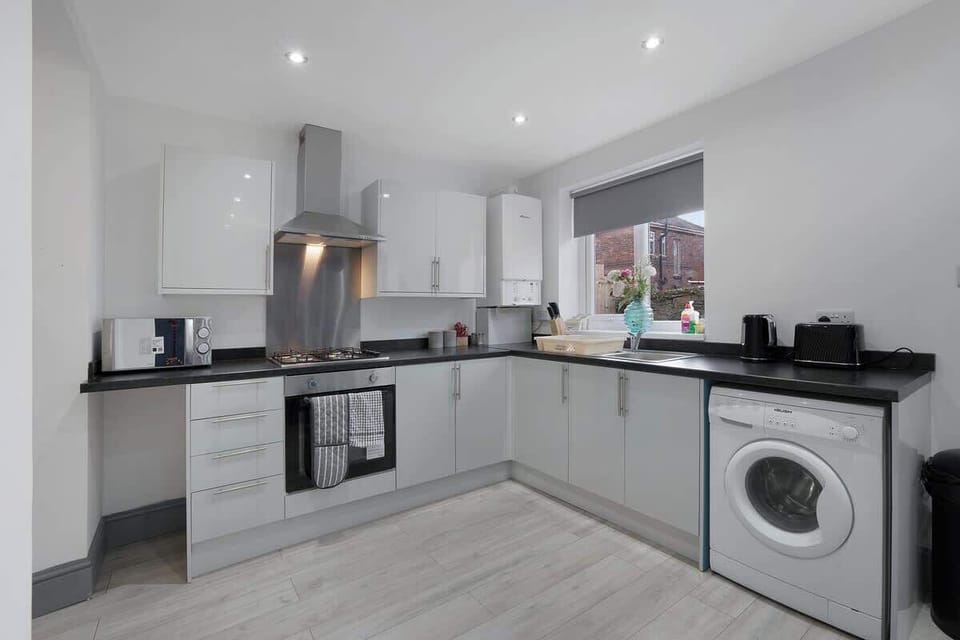 Family-friendly kitchen oasis equipped with all essentials, including a washer & dryer, oven, fridge and full cookware set. Plus, thoughtful touches like children's dinnerware ensure everyone feels right at home in this cozy culinary haven.