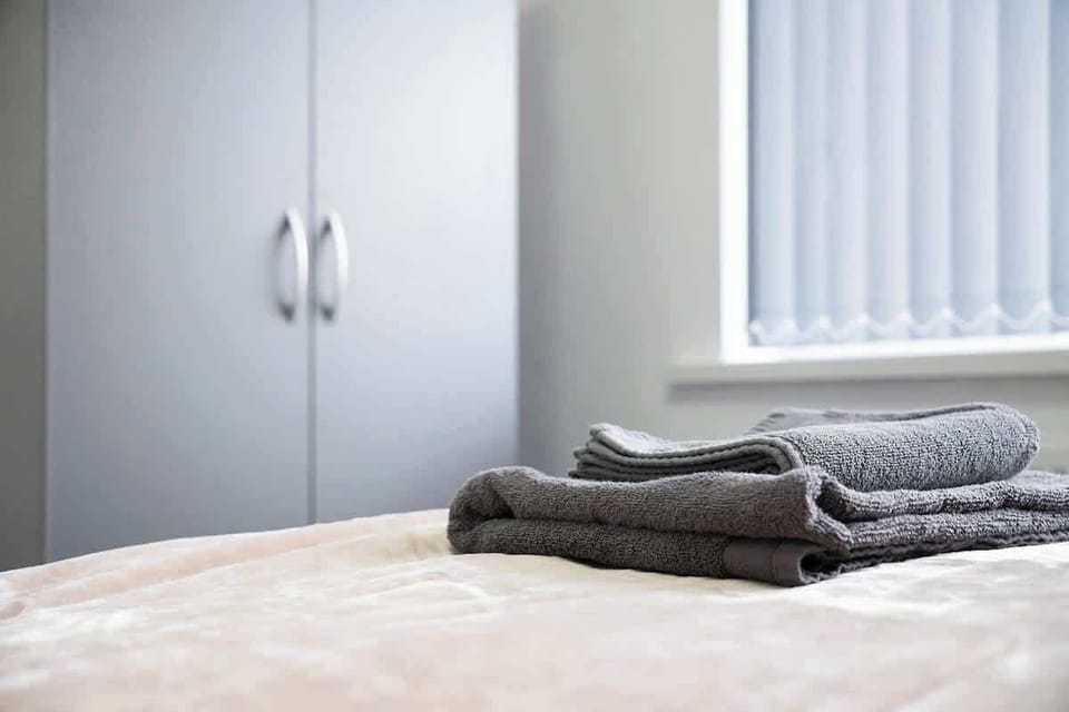 Relax in a cosy room furnished with a small double bed, bedside table, and wardrobe. Thoughtfully designed for comfort, it offers a peaceful place to unwind while keeping your belongings neatly organised.