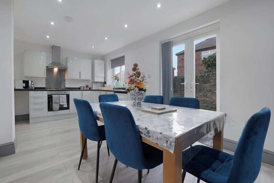 The dedicated dining area features a 6-seater table, creating the perfect spot for shared meals, remote working, or spending quality time together during your stay.