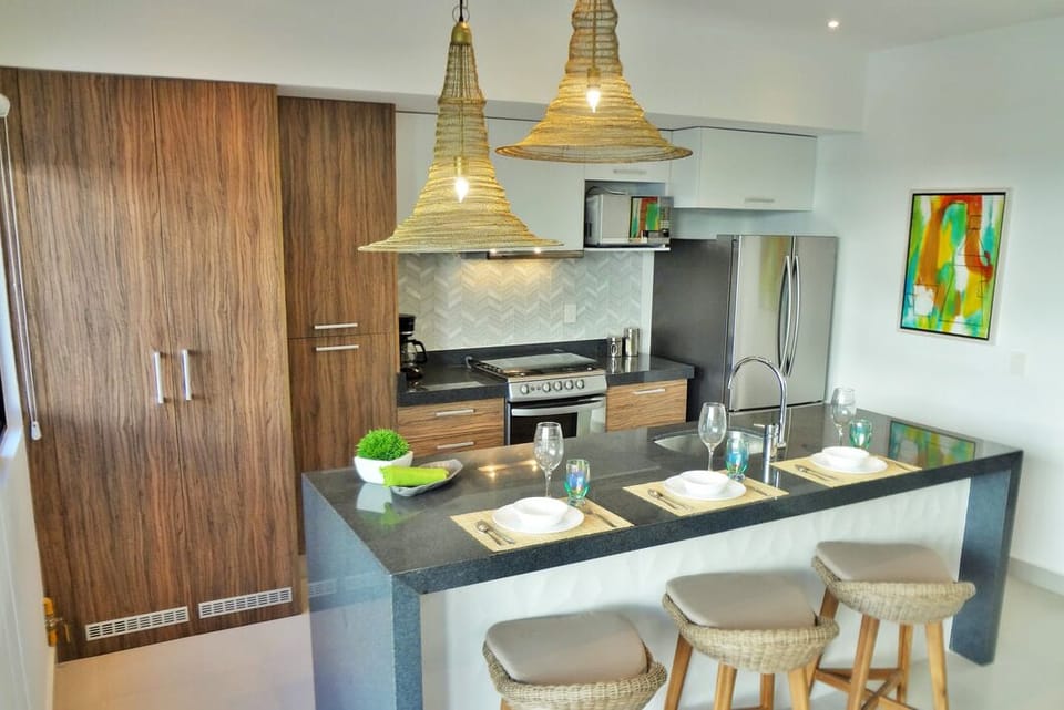 Kitchen set for breakfast Decorative tile  as backsplash and in front of island.
