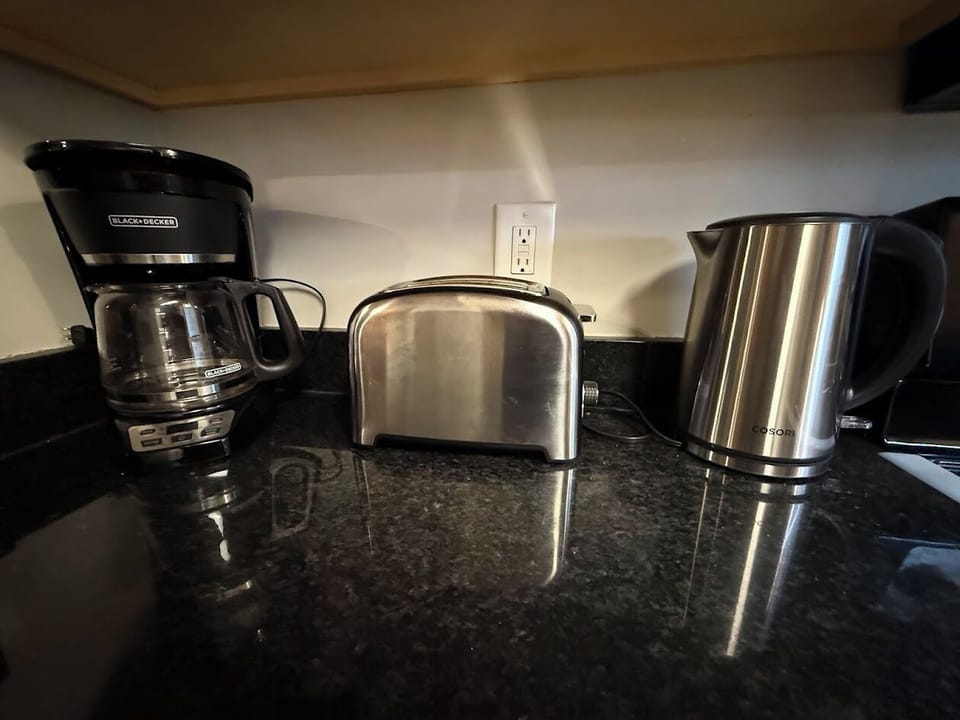 Coffee, toaster, and electric tea brewer are available to guests. 