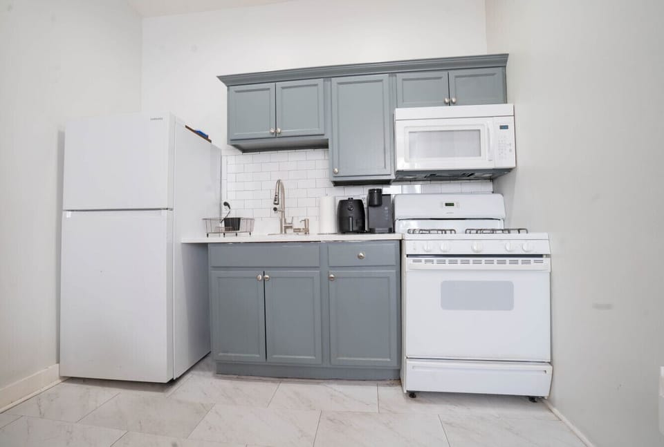 Kitchen — Stainless + Quartz