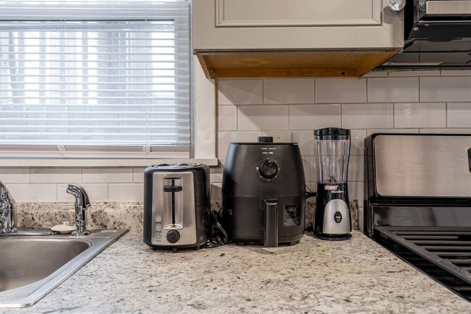 Floor 1 - Kitchen counter with toaster, air fryer, and blender for easy meals.