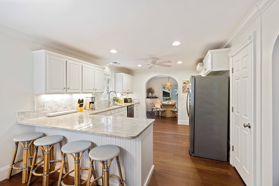 Updated kitchen with plenty of choices for eating! Barstools or the many dining tables.