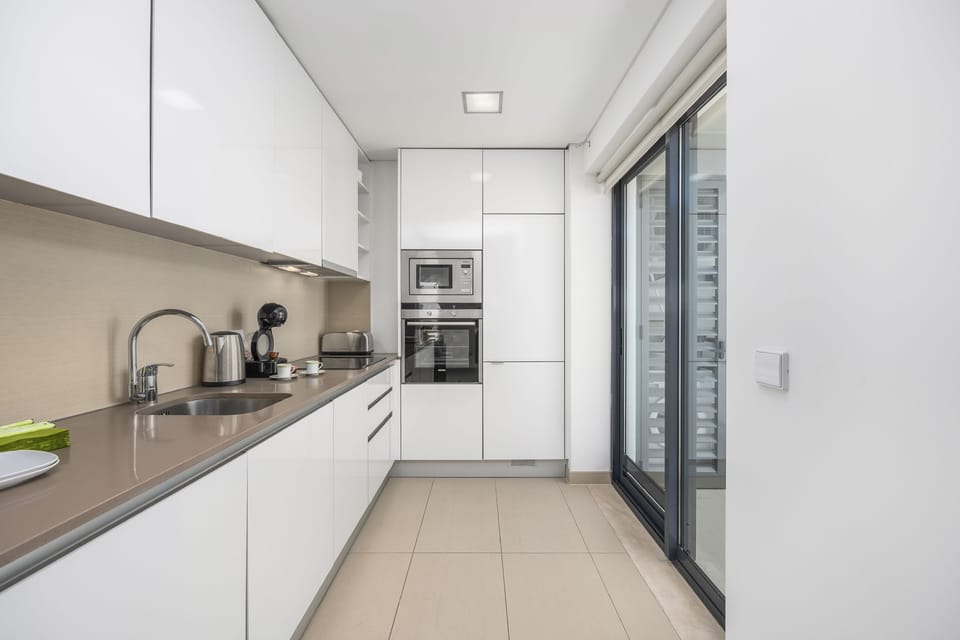 Kitchen area with patio door