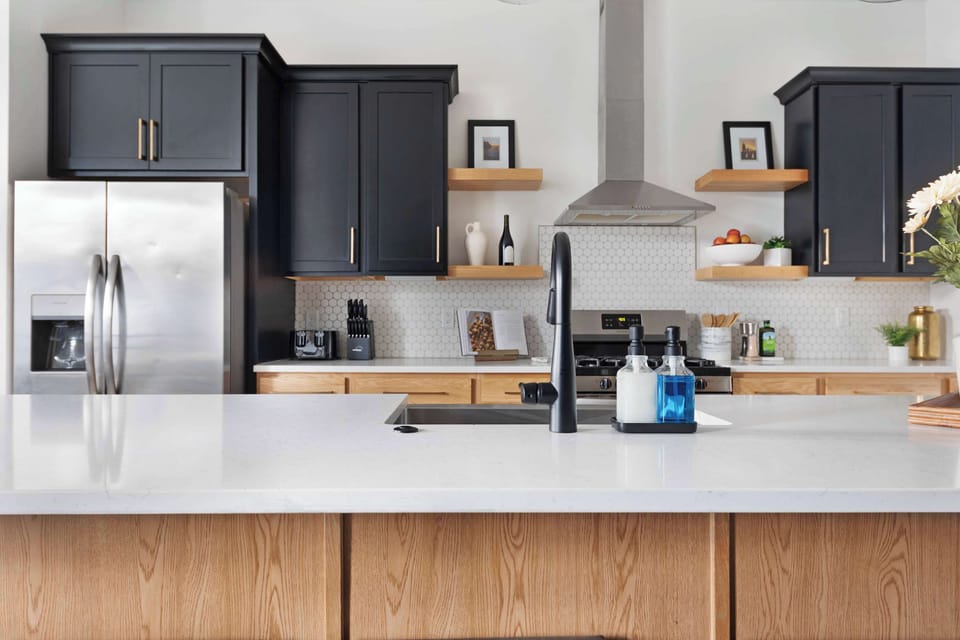 Fully Stocked Kitchen with Modern Appliances and Ample Storage

