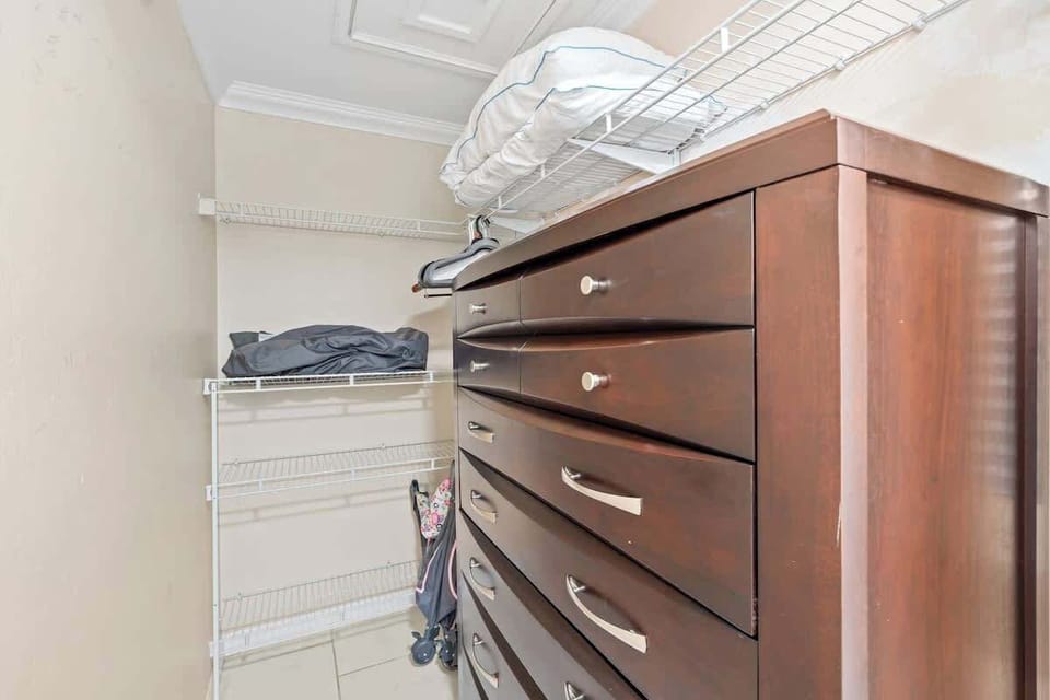 Store your wardrobe in style with a spacious walk-in closet, perfect for keeping everything organized during your stay #NaplesVacation