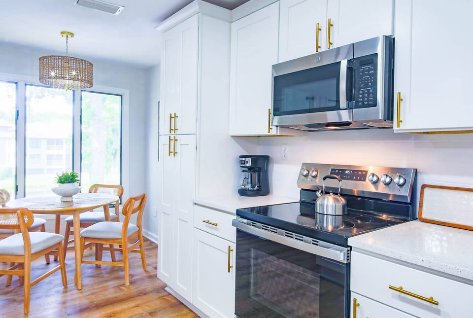 The dining table seats 4.  There are two additional stools at the kitchen island.