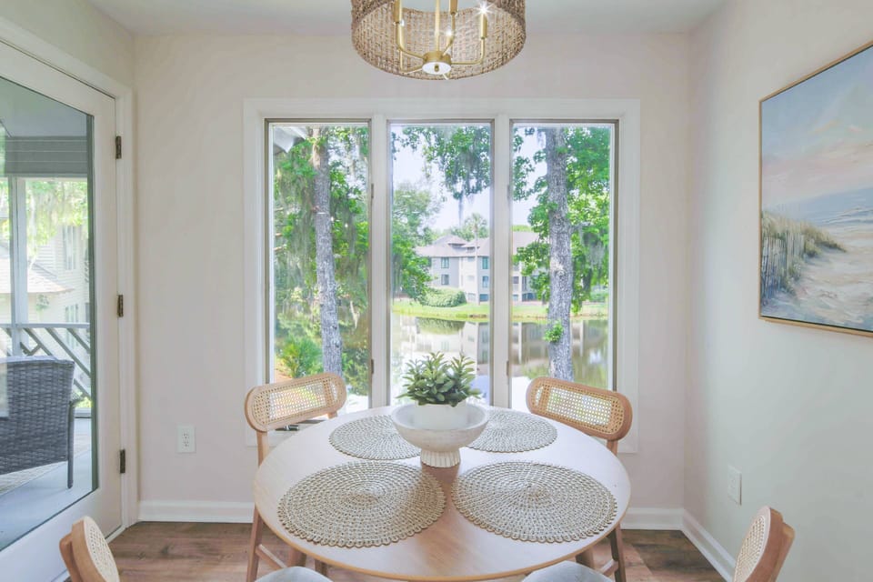 The dining table features mesmerizing views of the lagoon below.