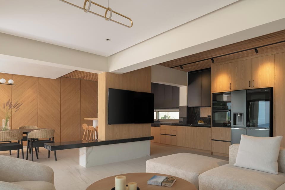 The living room features a lush corner sofa that comfortably accommodates the whole group, a 65” Smart TV, and a PlayStation 5 for ultimate entertainment