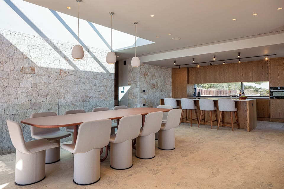 Modern appliances and chic furnishings create a refined yet inviting atmosphere
