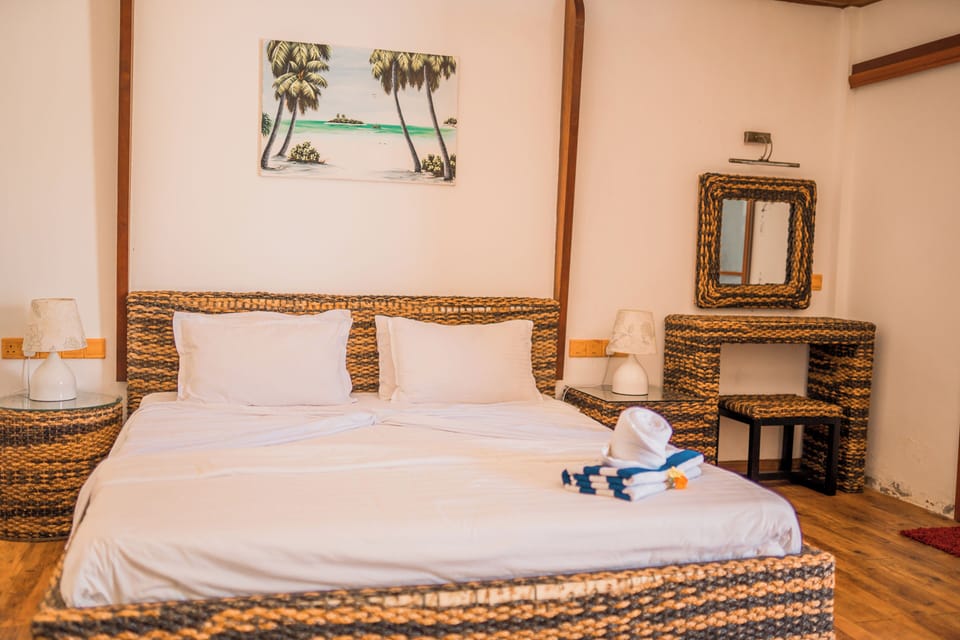Standard Room - Ground Floor | Minibar, in-room safe, desk, iron/ironing board