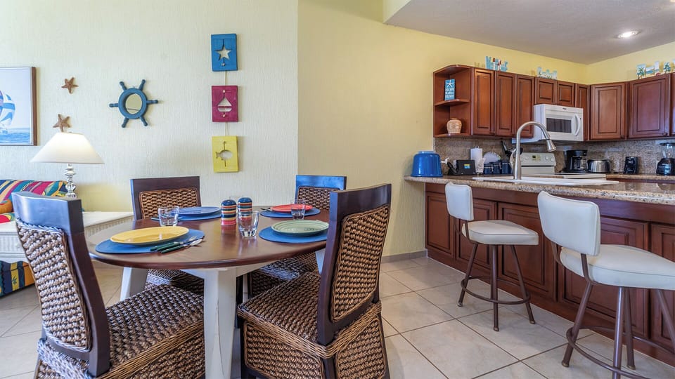 The kitchen counter and dining table.