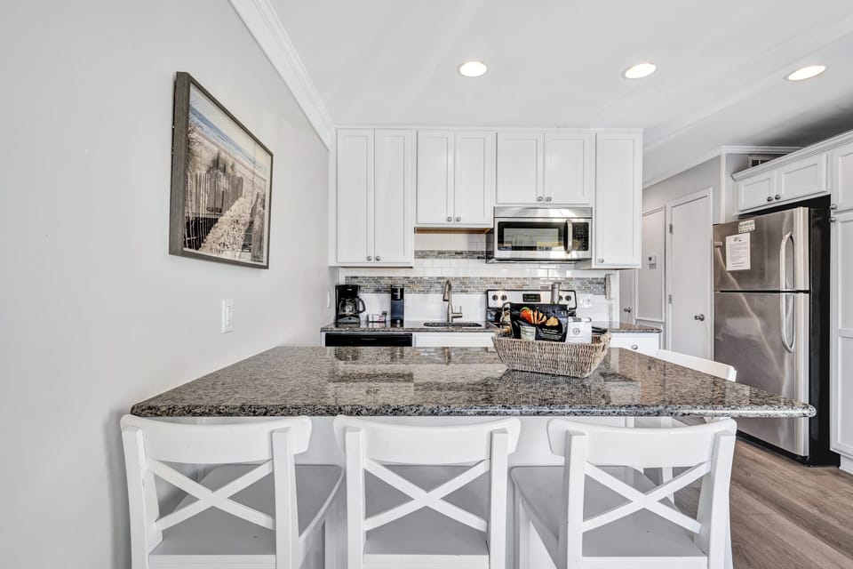 The open-concept kitchen, living and dining area ensures that everyone in the group stays included in the conversation and admires the culinary adventures of the chief among you.