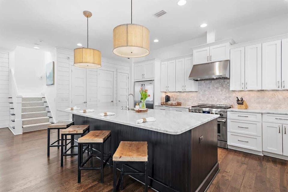 - Stunning kitchen island is ready for breakfast spreads, evening apps, or family chats - Stainless steel appliances and sleek marble give both style and substance - Pull up a stool, prep with ease, and enjoy your time together in comfort