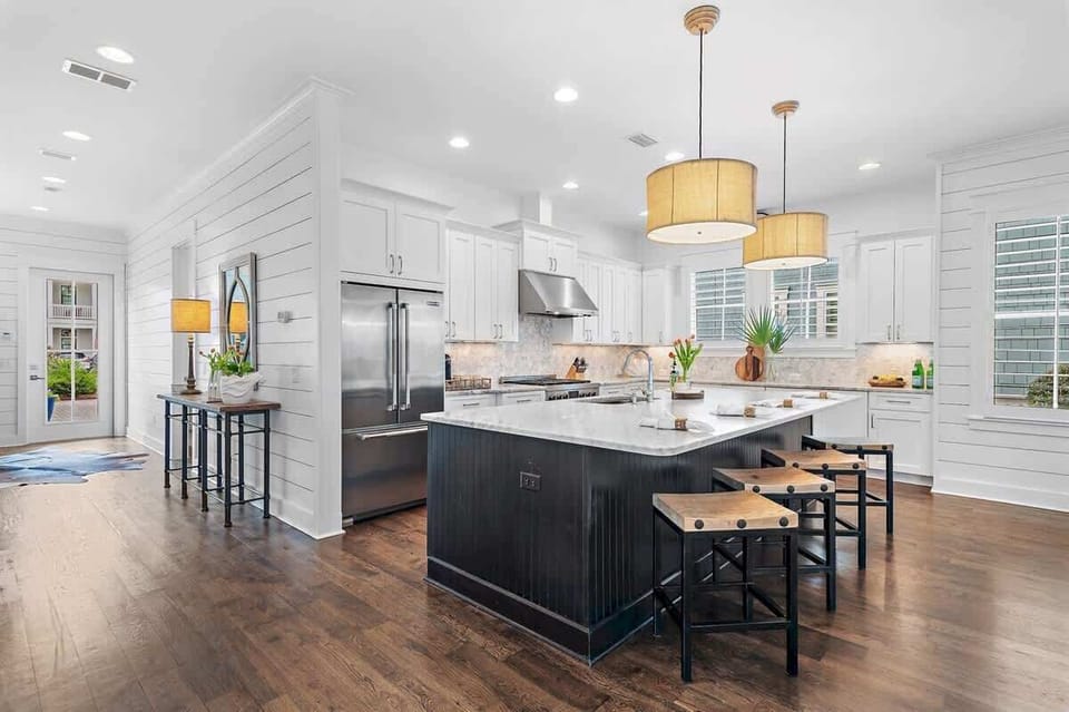 - Roomy kitchen with a wide island, bar stools, and everything you need to cook or snack - Stainless appliances and handy layout make meals a breeze, from breakfast to late night bites - Whether you're cooking or chatting, this spot feels just right