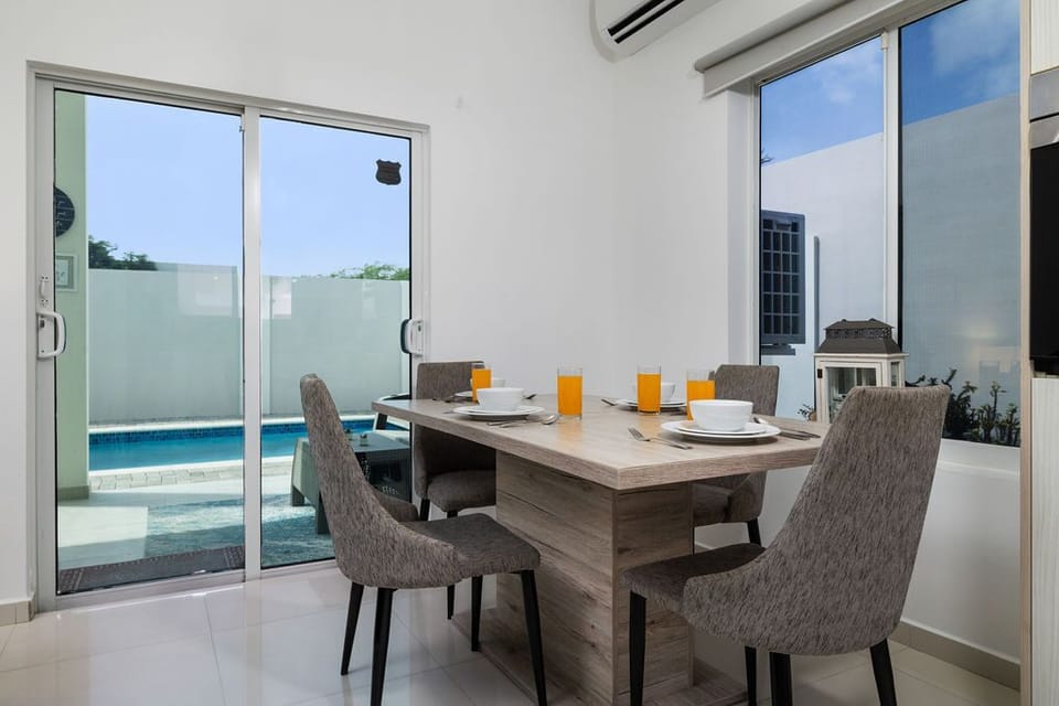 Start your mornings here with juice, coffee, and natural light flooding through large glass doors that open to your private pool just steps away.