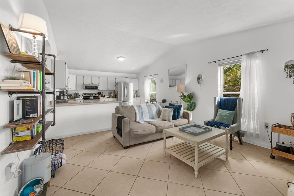 open living area with natural light and a view into the kitchen