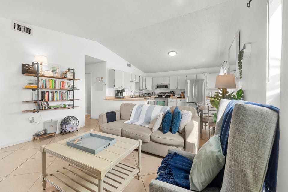 Open-concept living area with a modern kitchen and cozy seating.