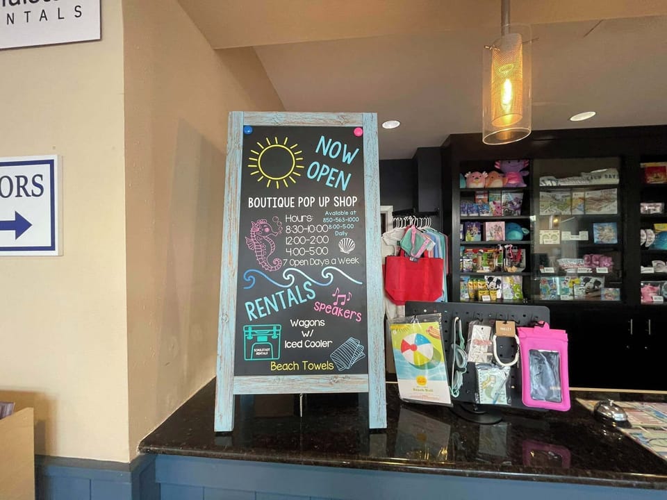 Boutique pop-up shop offering rentals and beach essentials in a casual setting