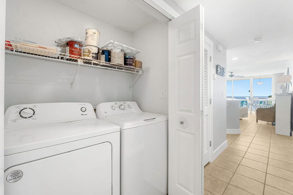 Laundry area with washer and dryer conveniently located near the living space.