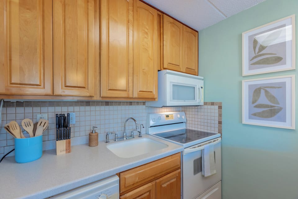 Well-appointed kitchen with a spacious island, modern appliances, and ample workspace.
