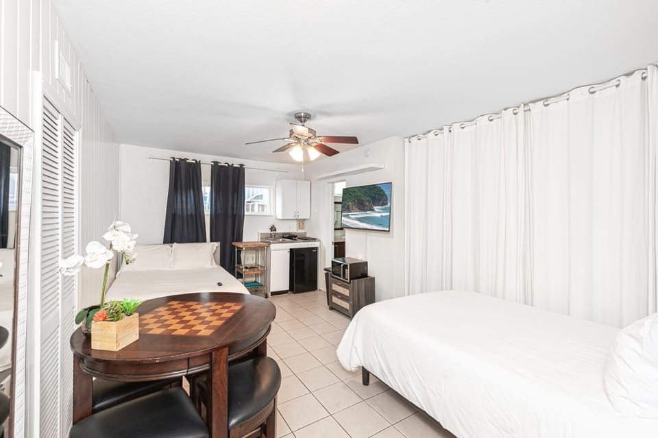 Bright, open studio layout designed for effortless coastal living
                