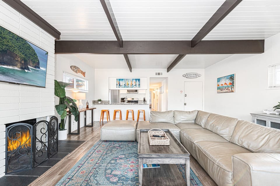 Refined living area with fireplace and relaxed coastal elegance
                