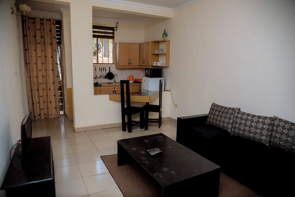 Classic Apartment, Hill View | Living area | Flat-screen TV