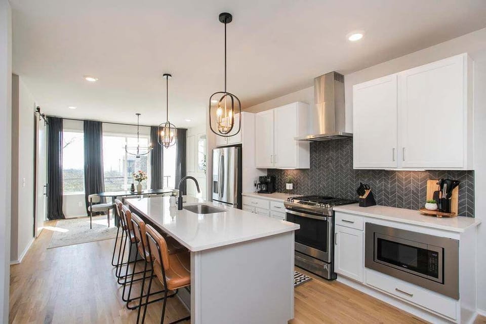 The large kitchen island can seat up to 4 people and provides an abundance of counter space