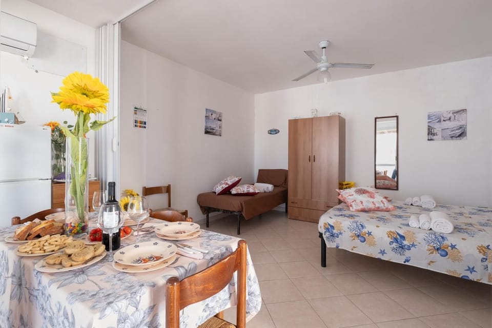 Apartment, City View | Living area | 32-inch flat-screen TV with cable channels
