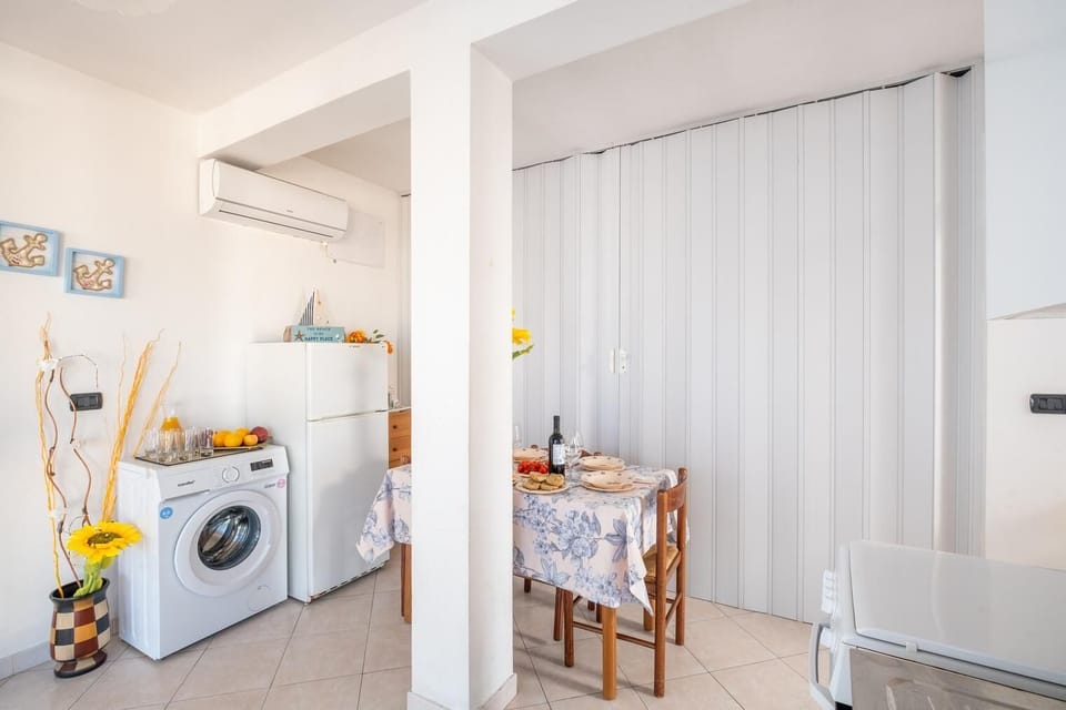 Apartment, City View | Living area | 32-inch flat-screen TV with cable channels