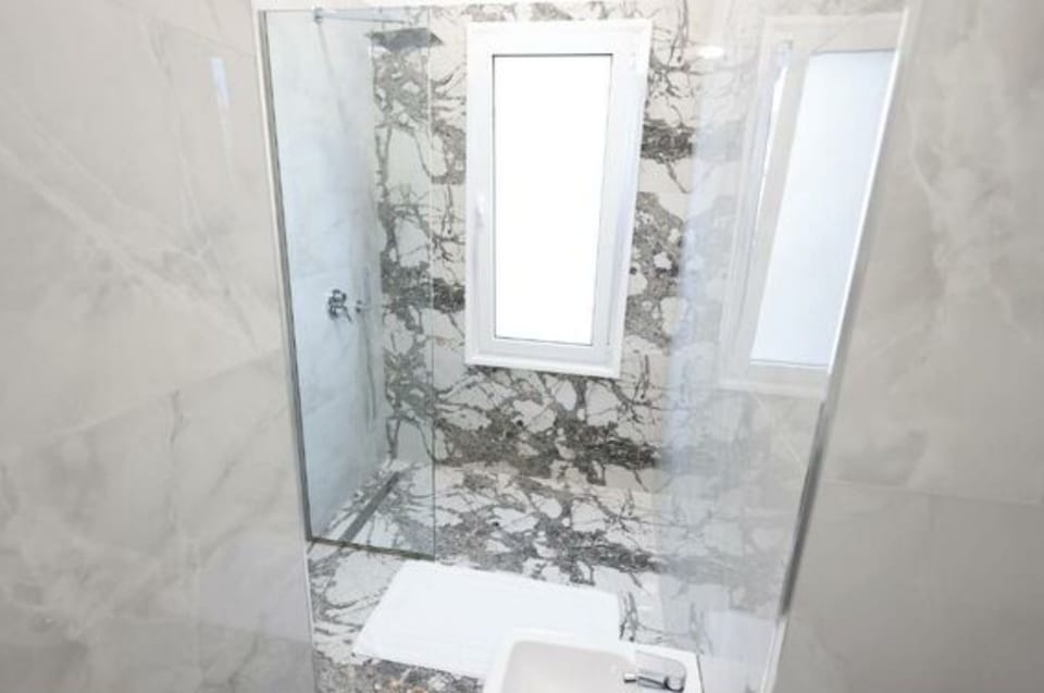 Shower, towels, toilet paper