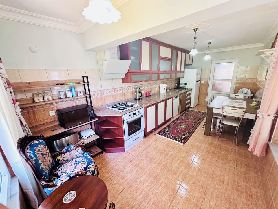 Fully equipped spacious kitchen, perfect for cooking and family meals.