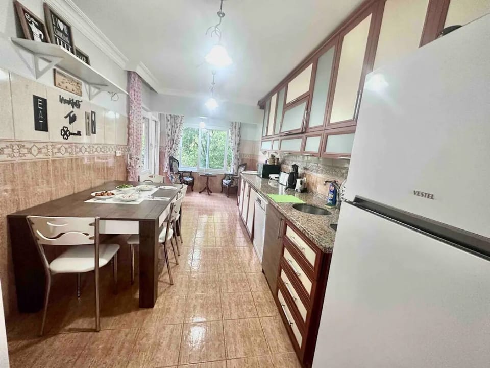 Fully equipped spacious kitchen, perfect for cooking and family meals.