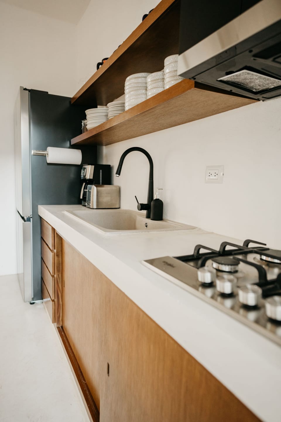Fully stocked kitchen with coffee maker, toaster, blender and microwave 