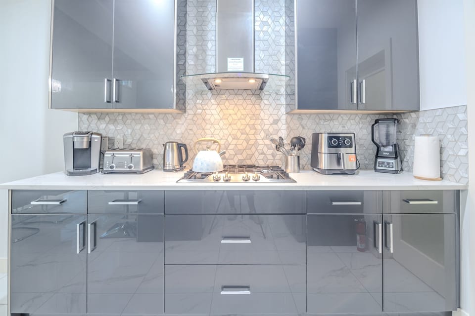 Fully equipped luxury kitchen with premium appliances and ample space for cooking and dining