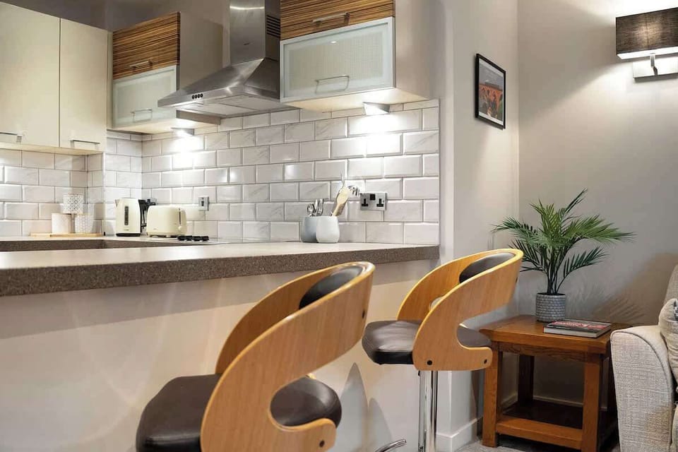 Kitchen equipped with all essentials, including a washer & dryer, oven, fridge and full cookware set.