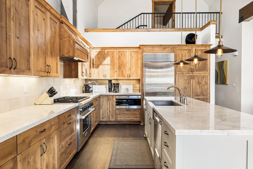 A chef's delight! The gourmet kitchen features sleek countertops, state-of-the-art appliances, and an island perfect for meal prep or casual dining.