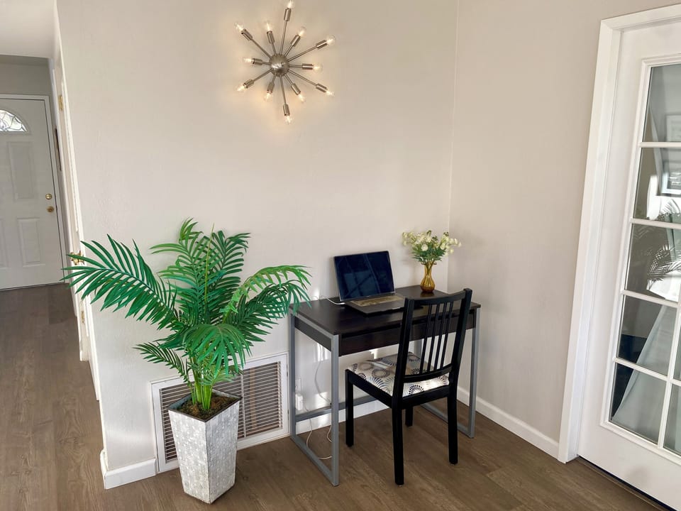 Useful office station lit by a vintage Sputnik lamp.