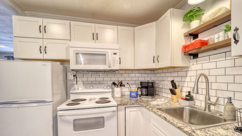 The kitchen is fully stocked with ingredients and supplies.